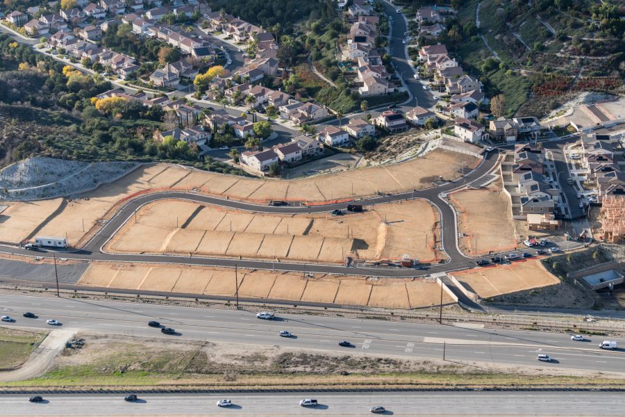 Aerial of view of graded dirt lots ready for new tract home construction in Los Angeles County California.